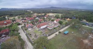 4K aerial drone shot of Suratthani, province in Southern of Thailand, showing Wat Phrathatchaiya, the famous historical site of Chaiya District,at noon time forward move.