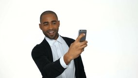 Handsome afro american business man making selfie photo on smartphone over white background