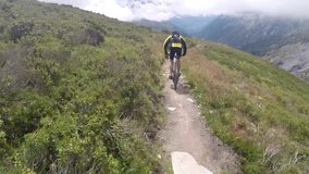 GoPro head mounted clip of a mountain biker descending a narrow track at Col de Balme near Chamonix 