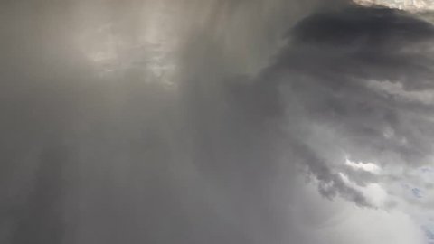 Time-lapse video of an intense rotating supercell thunderstorm, with impressive lightning strikes, dark skies and mesocyclone storm structure. Full HD storm clouds.