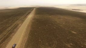 Peru, South america: AERIAL of a Car in the desert \x96 4k video footage