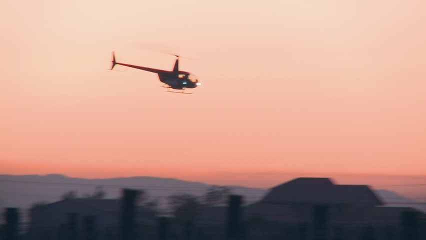 2 helicopters at sunrise
