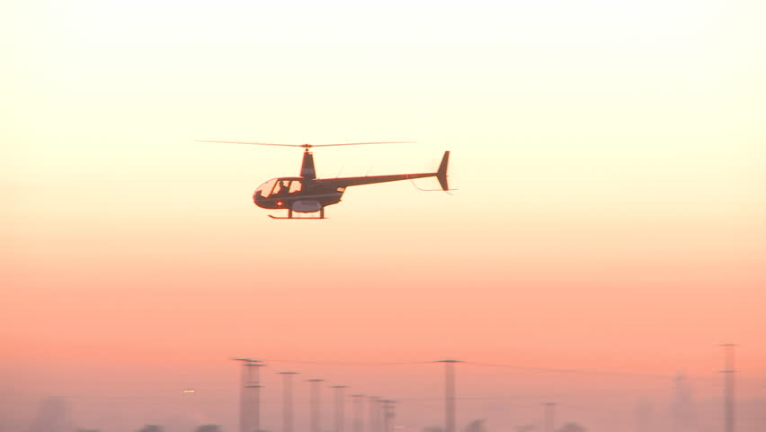 Two helicopters in the dawn light