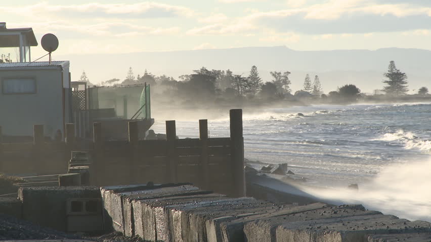 Large storm driven waves smash into a coastal property