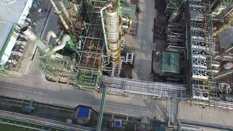 Oil Gas Refinery Drone 4K, Aerial top down view over oil refinery or chemical factory and power plant with many storage tanks and pipelines
