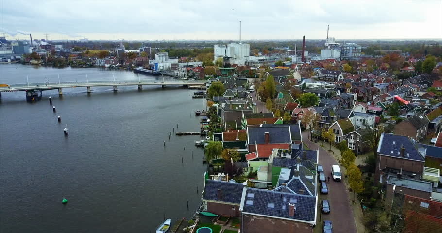 Colorful Netherlands Waterfront Village with Bridge and Canal Houses.