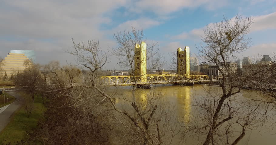 4k, Golden Bridge in downtown Sacramento Aerial, while the river is nearing flood stage, just after a week of heavy rain.