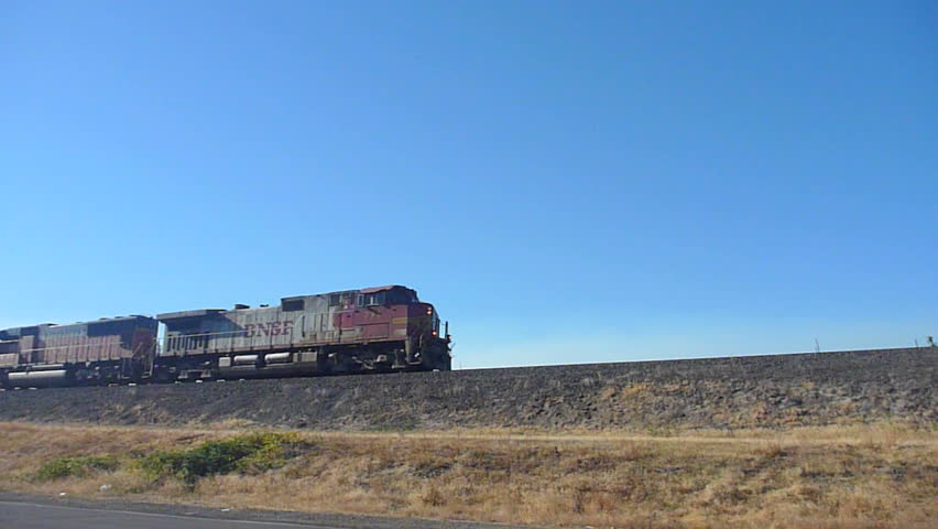 VANCOUVER, WASHINGTON - CIRCA JANUARY 2012: Train passes by on high railroad