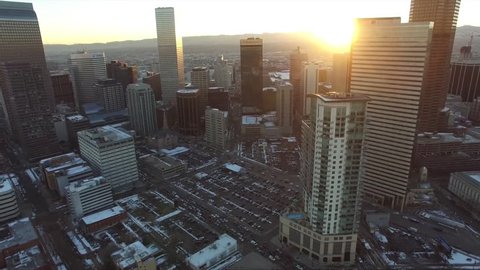 Aerial Drone rising to reveal Sunset over Downtown Denver