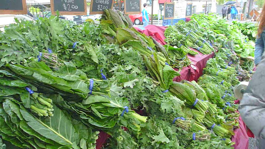 PORTLAND, OREGON - CIRCA 2011: People shop for organic vegetables on sale at