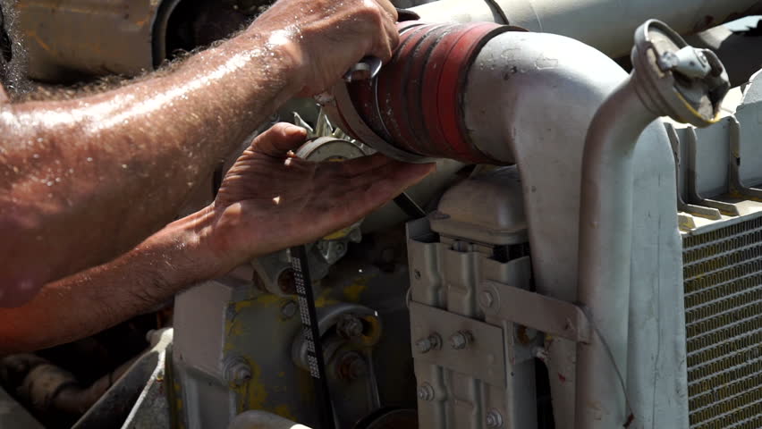 A man welds a tube with a metal clamp.
About industry, engineering industry, protection, safety at work.