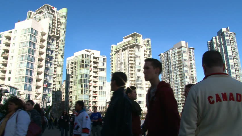 VANCOUVER, BRITISH COLOMBIA - CIRCA MARCH 2010: People and high rise buildings