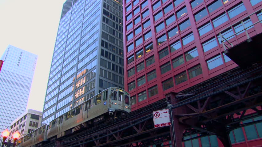 CHICAGO - CIRCA MARCH 2012:  Downtown area with El Train traveling fast by