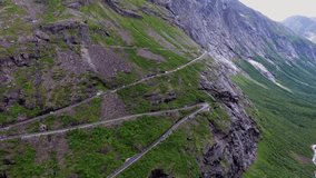 Troll's Path Trollstigen or Trollstigveien winding mountain road in Norway. Aerial footage
