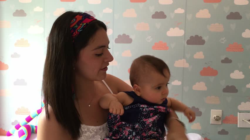 Young mother holding her month