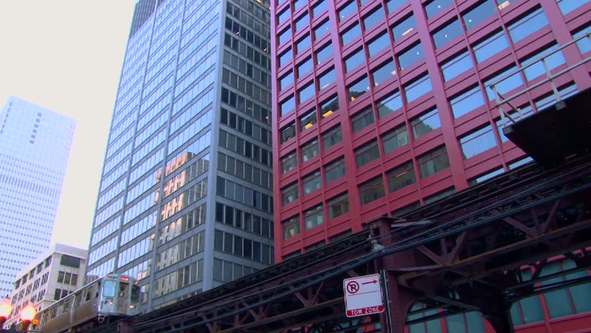 CHICAGO CIRCA FEBRUARY 2011: Downtown area with El Train traveling by buildings