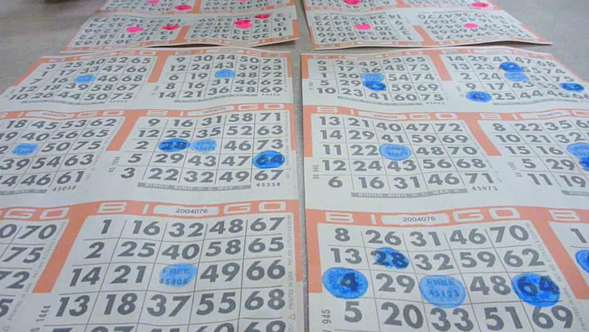 PORTLAND, OREGON - CIRCA MAY 2010: People daub ink on bingo cards in veteran