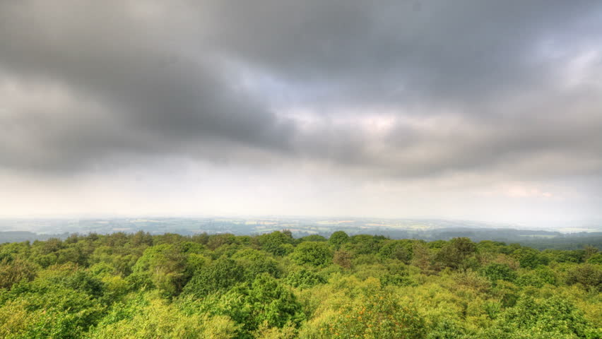Clouds over forest, HD time lapse clip, high dynamic range imaging