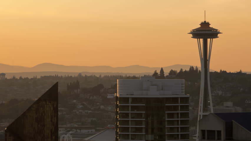 Timelapse of Seattle Space Needle during sunset. Space Needle in new orange