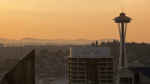 Timelapse of Seattle Space Needle during sunset. Space Needle in new orange painting for 50 year anniversary of the world exhibition in 2012.