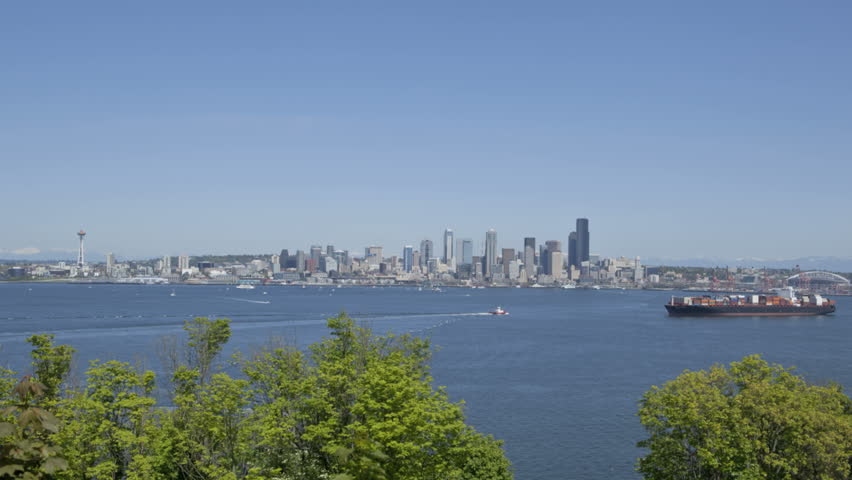 Timelapse of Seattle Skyline with Space Needle and Harbor Bay. Space Needle in
