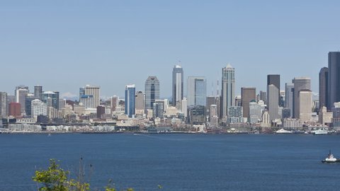 SEATTLE, USA - MAY 12: Timelapse of a cargo freighter in front of the Seattle Skyline on May 12th 2012 in Seattle, USA. 
