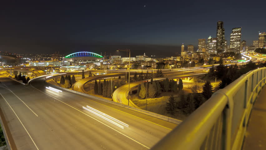 Timelapse of Interstate Traffic during sunset with Seattle Skyline in the