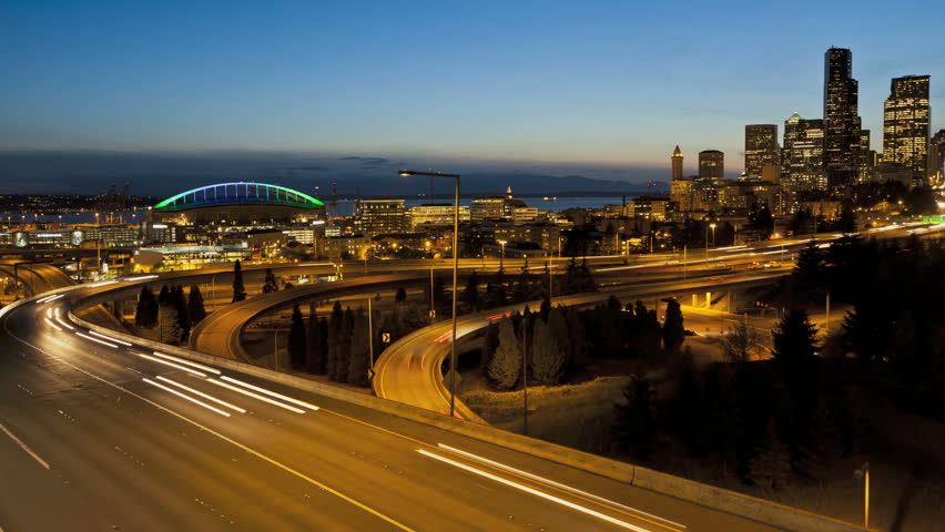 Timelapse of Interstate Traffic during sunset with Seattle Skyline in the