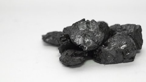 A sample  from an industrial graphite mine of graphite ore that is eventually processed and used in batteries, carbon steel, lubrication, electrodes and other industrial uses.