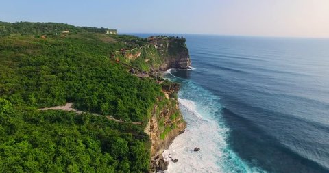Uluwatu cliff aerial footage, Bali, Indonesia. Camera moves along the cliff