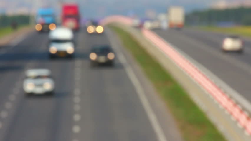 cars traveling on highway - defocused timelapse