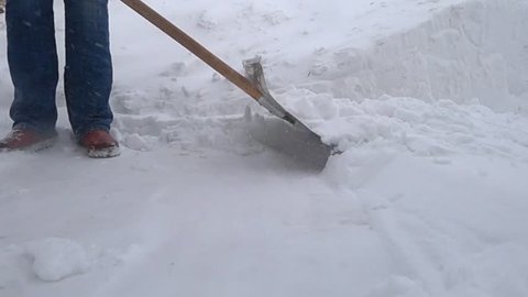 To throw the snow. shovel snow removal. Snowstorm.