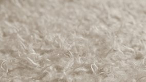 Tilting over white faux fun material synthetic fibers 4K 2160p UHD footage - Fake fur clothing detailed surface slow tilt 3840X2160 UltraHD video