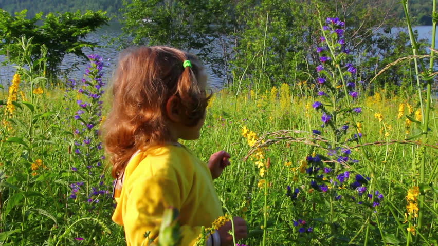 little girl and butterfly on flower