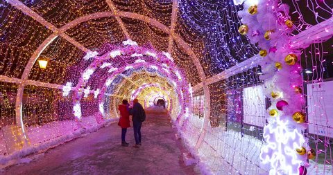 MOSCOW, RUSSIA - JANUARY 19:  People walk through the Christmas decorations and lights at night, on January 19, 2017 in Moscow.