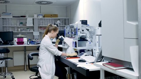 Young scientist works in modern biological laboratory
