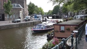 Amsterdam city, boat in river, beautiful cityscape