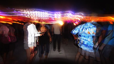 POPOVKA, UKRAINE - JULY 20: Image sequence using long exposure shooting technique to capture people dancing on dancefloor at Kazantip electronic dance music festival on July 20, 2009 in Popovka, Ukraine.