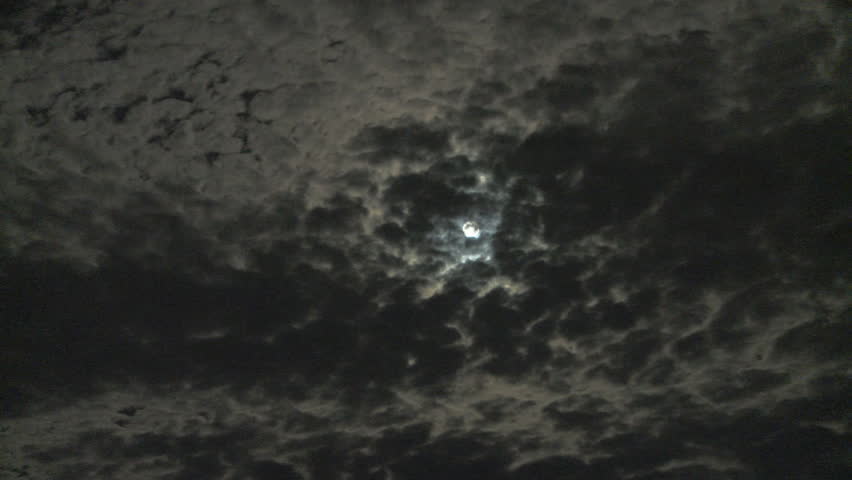Moon passing through clouds time lapse