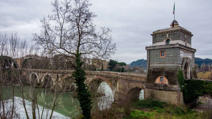 Ponte Milvio, old roman bridge on the river Tevere in Rome, Italy. Time lapse

