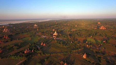 Bagan, Myanmar (Burma), aerial view of ancient temples and pagodas at sunset.