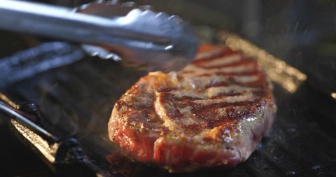 Juicy tasty steak cooking by chef in restaurant