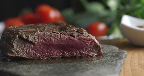 Tasty food, steak cut with knife on plate in luxury restaurant