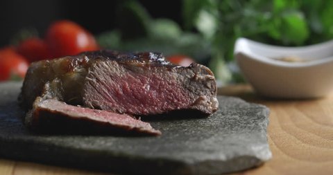 Delicious steak sliced by chef in luxury restaurant