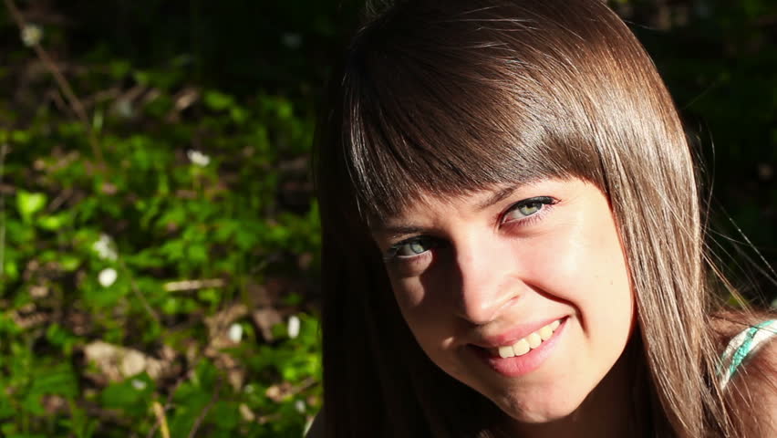 beautiful girl in forest on flowers field