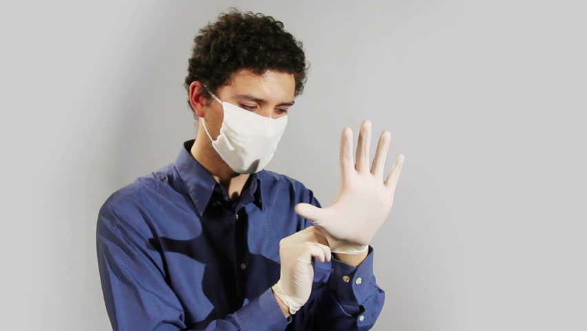 young doctor wearing medical gloves closeup