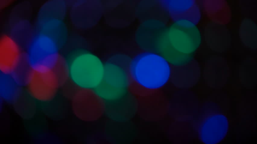 Moving particles. Colorful, blurred, bokeh lights background.