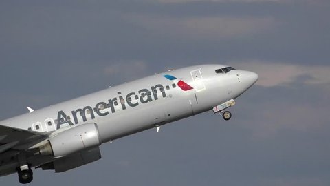 American Airlines plane taking off from airport runway - Logan Airport Boston, Massachusetts USA - June 5, 2015
