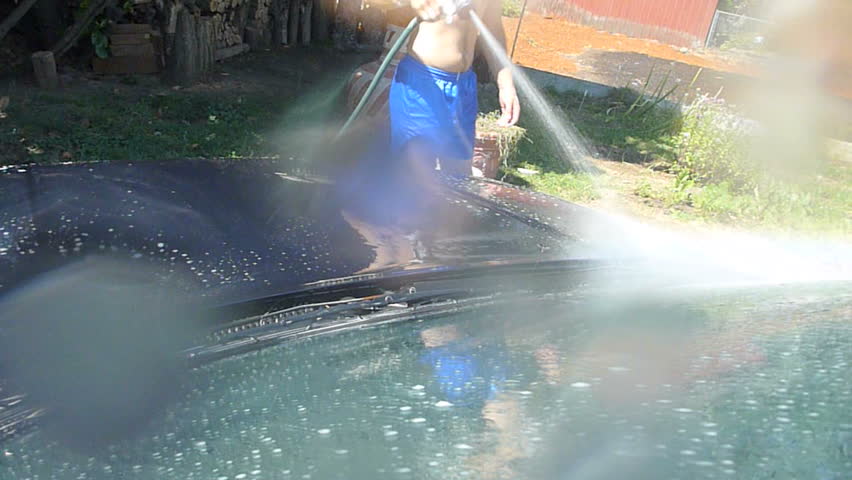 Man washes car in time lapse.