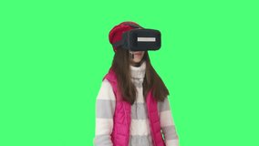 kid and glasses of virtual reality on a green background